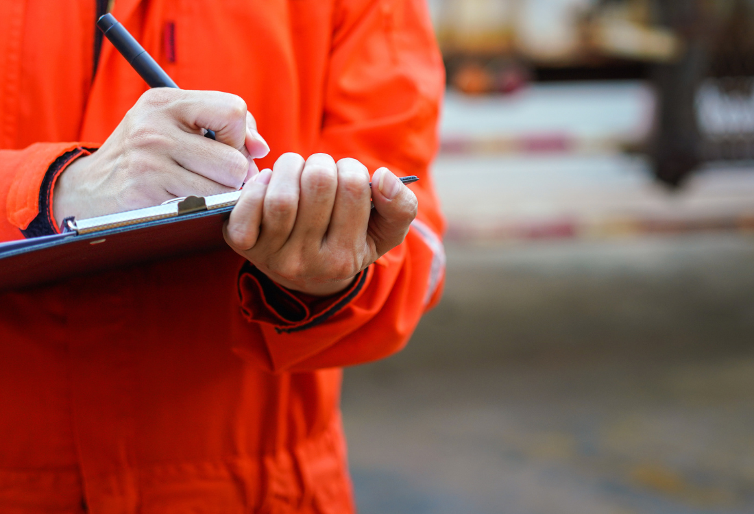 Pharmaceutical audit checklist being completed at a pharmaceutical plant.