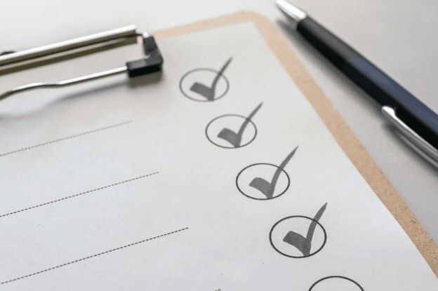 Audit checklist with completed checks representing quality and compliance audits in the pharmaceutical industry.